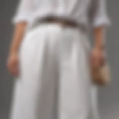 Close-up of fashionable plus size woman in white linen wide leg pants with stylish accessories