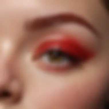 Close-up of red waterproof eyeliner applied on a model's eye