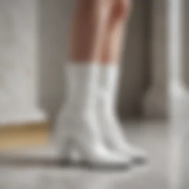 Sophisticated Style of White Boots Elegant white boots on a marble surface