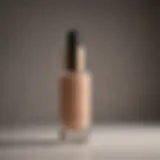 Elegant foundation bottle with gold accents for mature dry skin