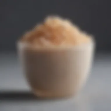 A close-up of a facial exfoliant mixture in a small bowl, showcasing its texture.