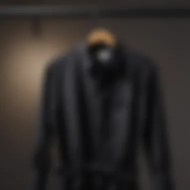 Elegant black button-down shirt draped on a hanger