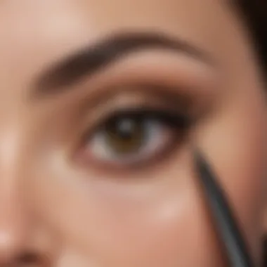 Close-up of precise pencil eyeliner technique