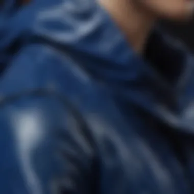 Close-up of high-quality stitching on royal blue rain jacket