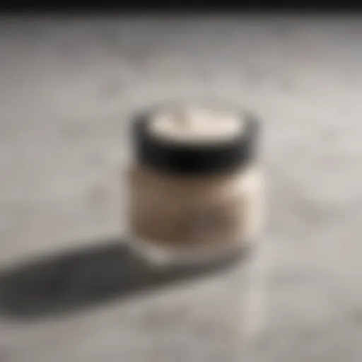 A close-up of a luxurious dark spot cream jar on a marble countertop