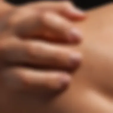 Expert Application Technique for Self-Tanners A close-up of a hand applying self-tanner on skin with precision.
