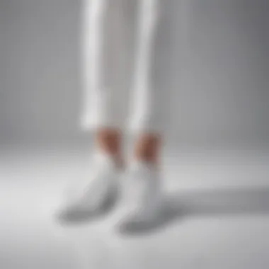 Casual Chic: White Leather Athletic Shoes Elegant pairing of white leather athletic shoes with casual attire