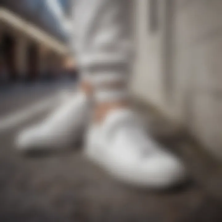 Dynamic lifestyle shot featuring white leather athletic shoes in an urban setting