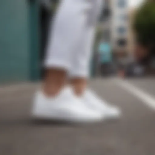 Stylish all-white tennis shoes on a trendy street
