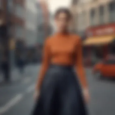 Chic Urban Styling A stylish ensemble featuring a pleated skirt paired with a tailored top in an urban setting.
