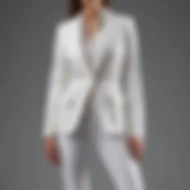 Close-up of straight leg white jeans paired with a structured blazer