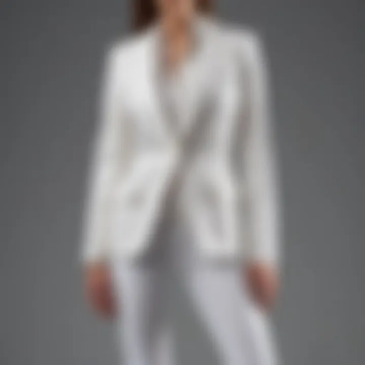 Close-up of straight leg white jeans paired with a structured blazer